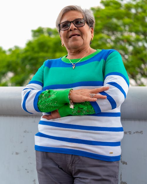 Elderly Woman Standing with Arms Crossed