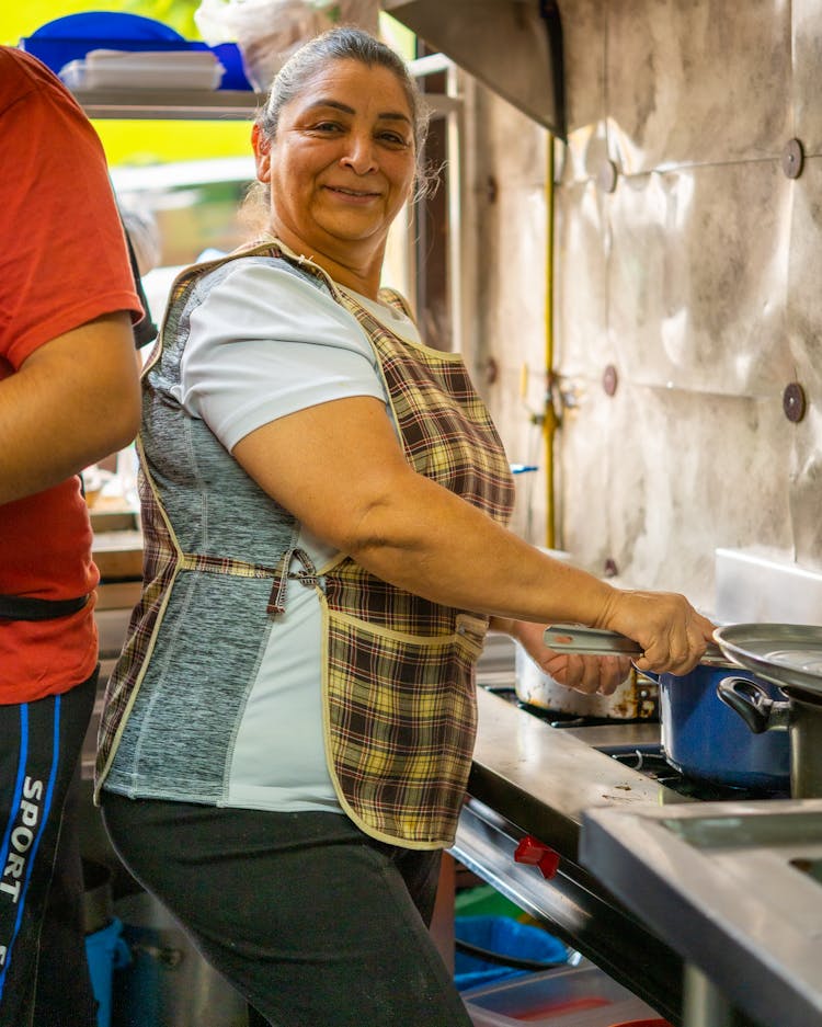 Woman Cooking In A Kitchen 