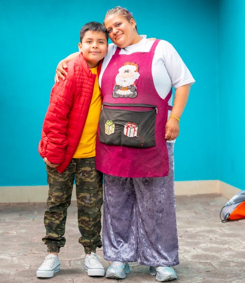 Woman in an Apron Hugging her Son 