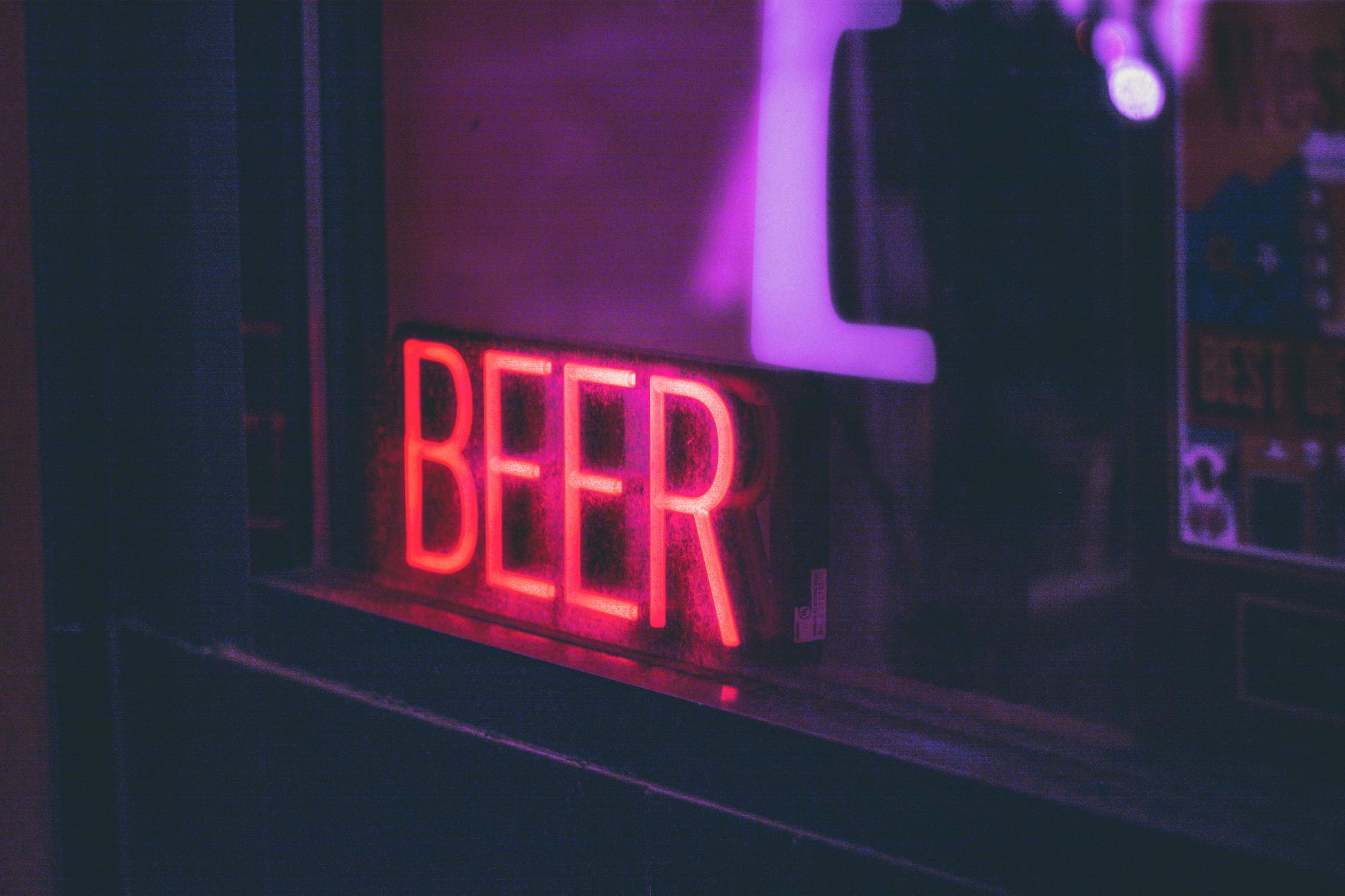 A neon sign saying BEER