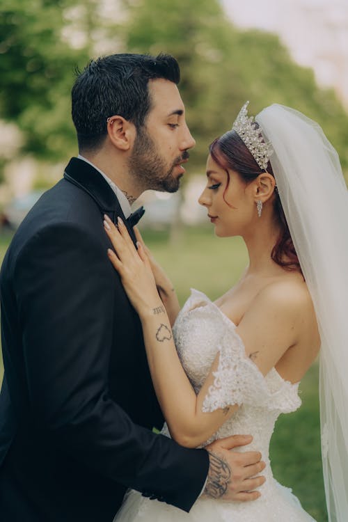 Bride and Groom Posing Outdoors 