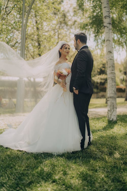 Bride and Groom Posing Outdoors 