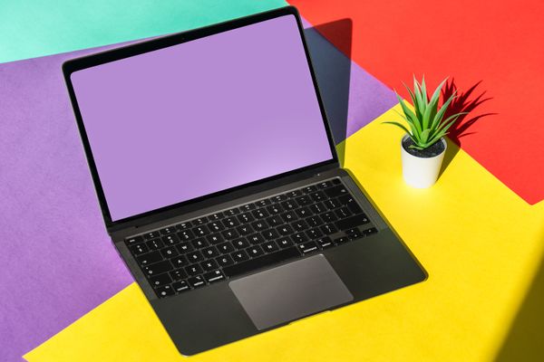 Laptop in a colorful studio photographed by Jakub Zerdzicki on Pexels