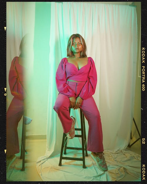 Film Photograph of a Woman in Pink Outfit Posing in Studio 