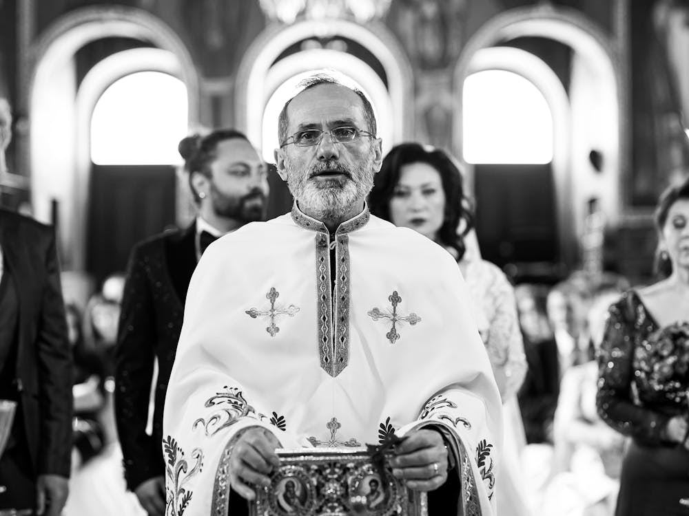 Black and White Photo of Orthodox Priest Performing Ceremony