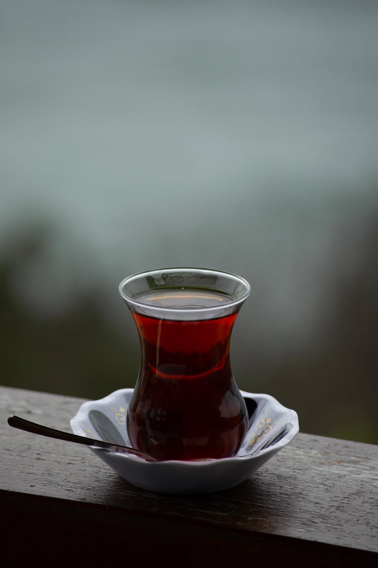 A Glass Of Tea On A Balustrade