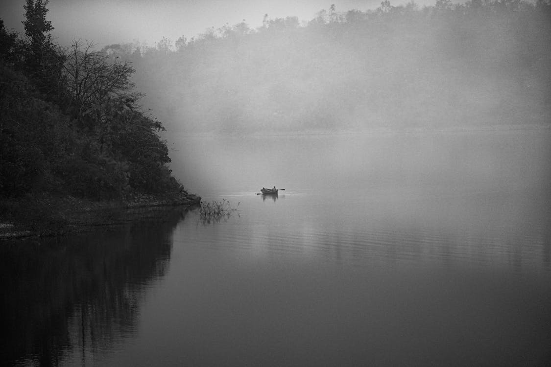 Boat under Fog on Lake in Black and White