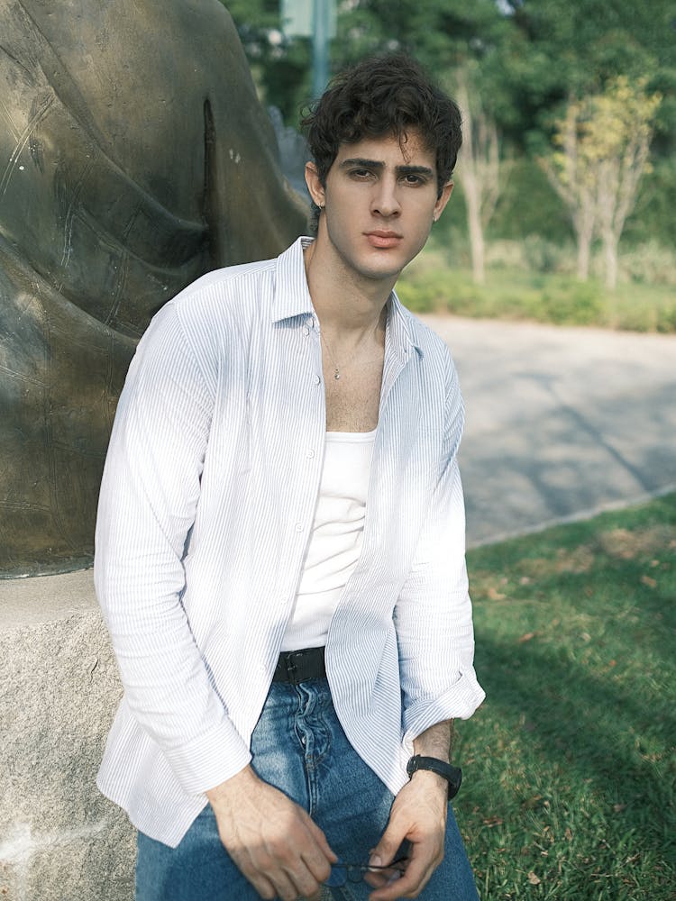 A Man Wearing White Shirt In A Park