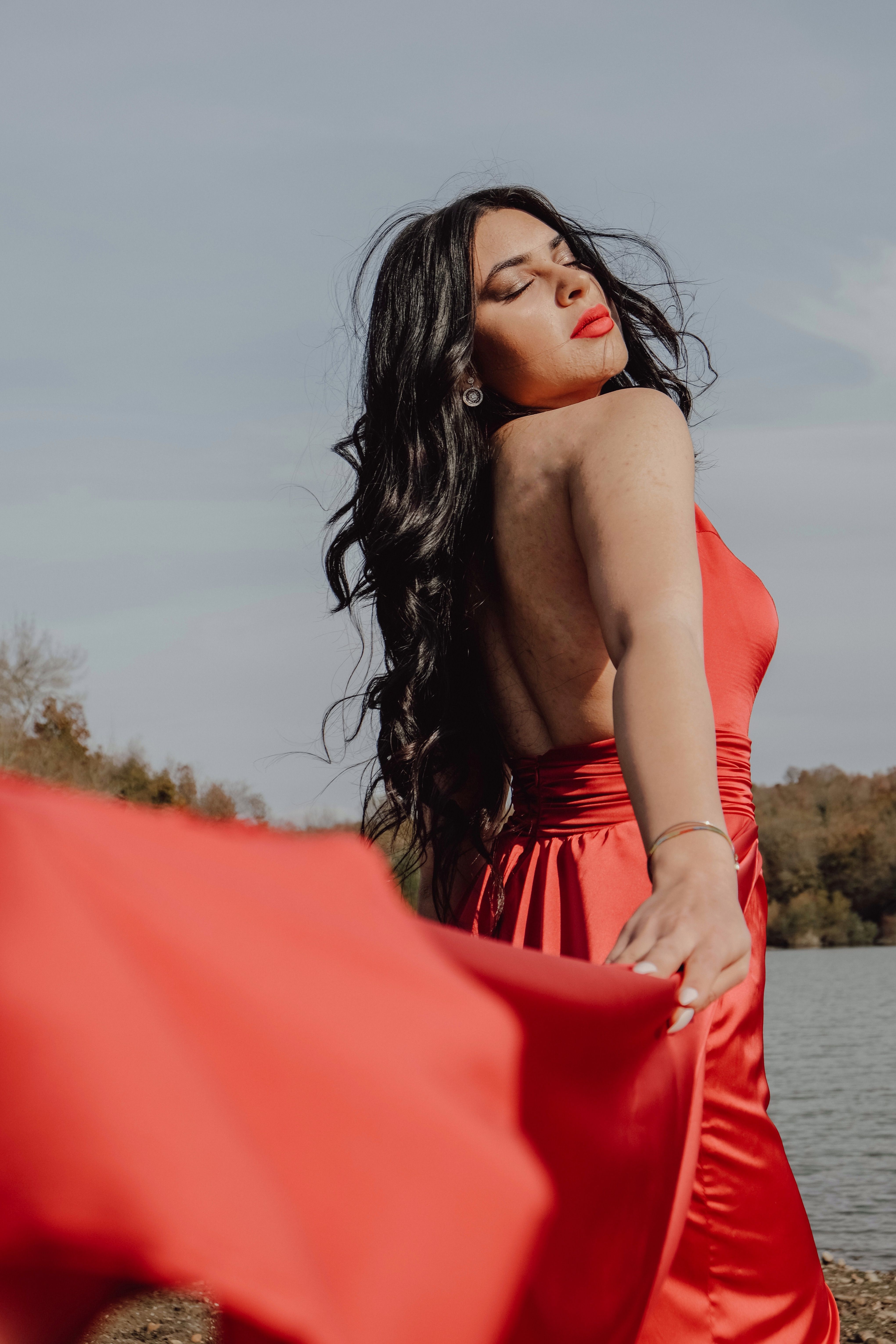 A Portrait of a Woman Wearing Red Dress · Free Stock Photo