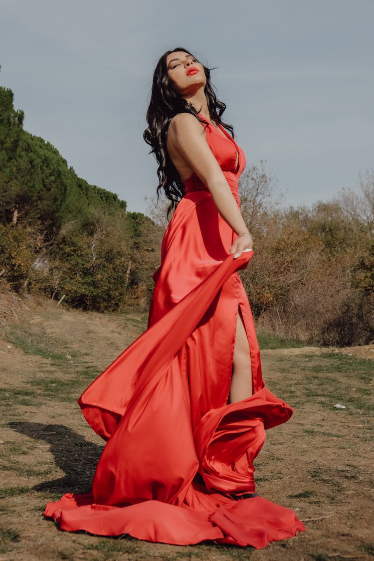 A Woman Wearing Red Dress On The Beach