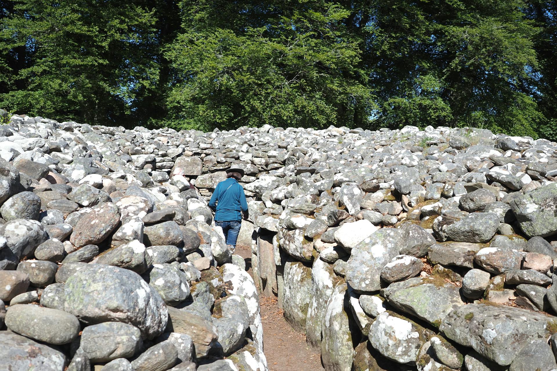 Woman Standing on a Path in Clava Cairns, Inverness, Highlands, Scotland, United Kingdom