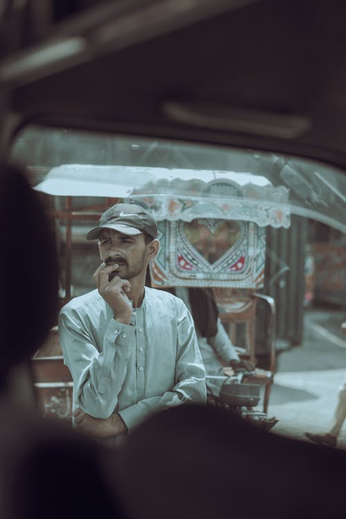 Thinking Man in Cap and Shirt