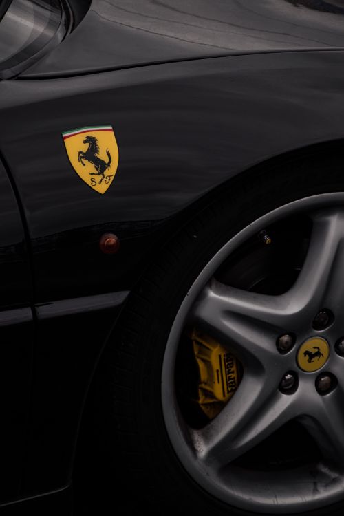 Free Detailed shot of a black Ferrari supercar featuring the logo and wheel, captured in Istanbul. Stock Photo
