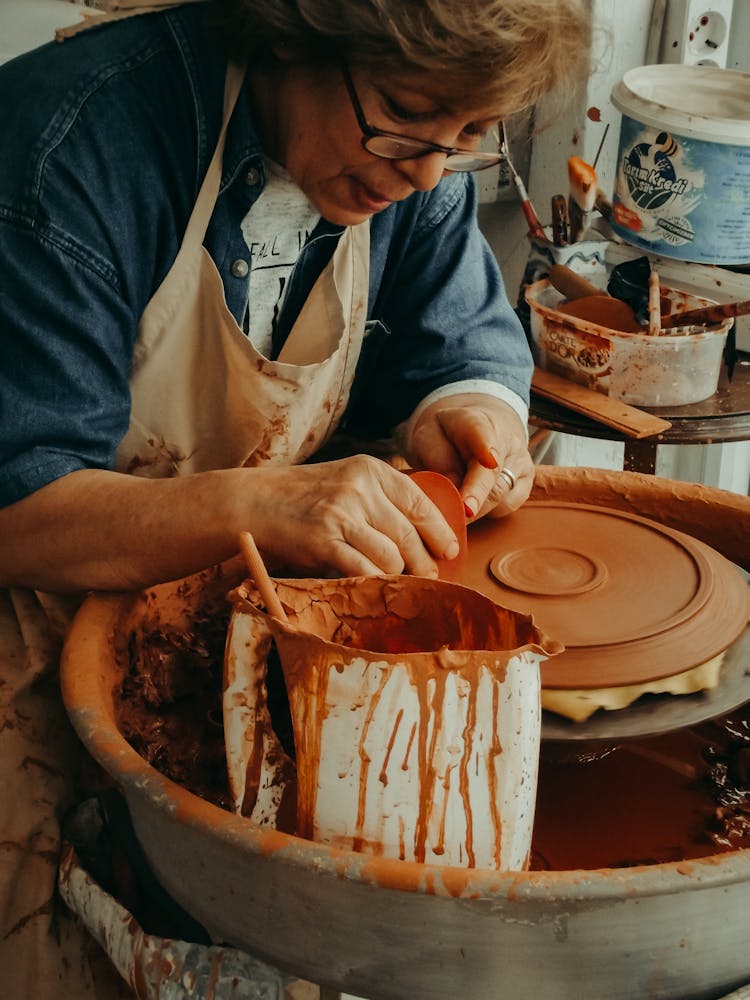 Woman Sculpting From Clay 