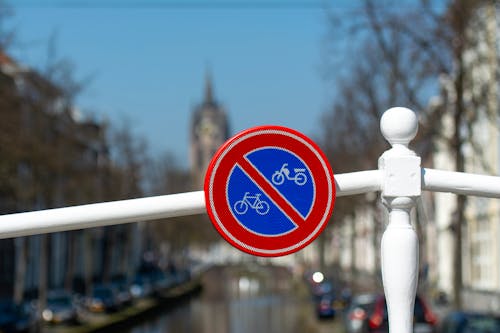 No Parking for Bicycles or Mopeds Sign on the Bridge Railing