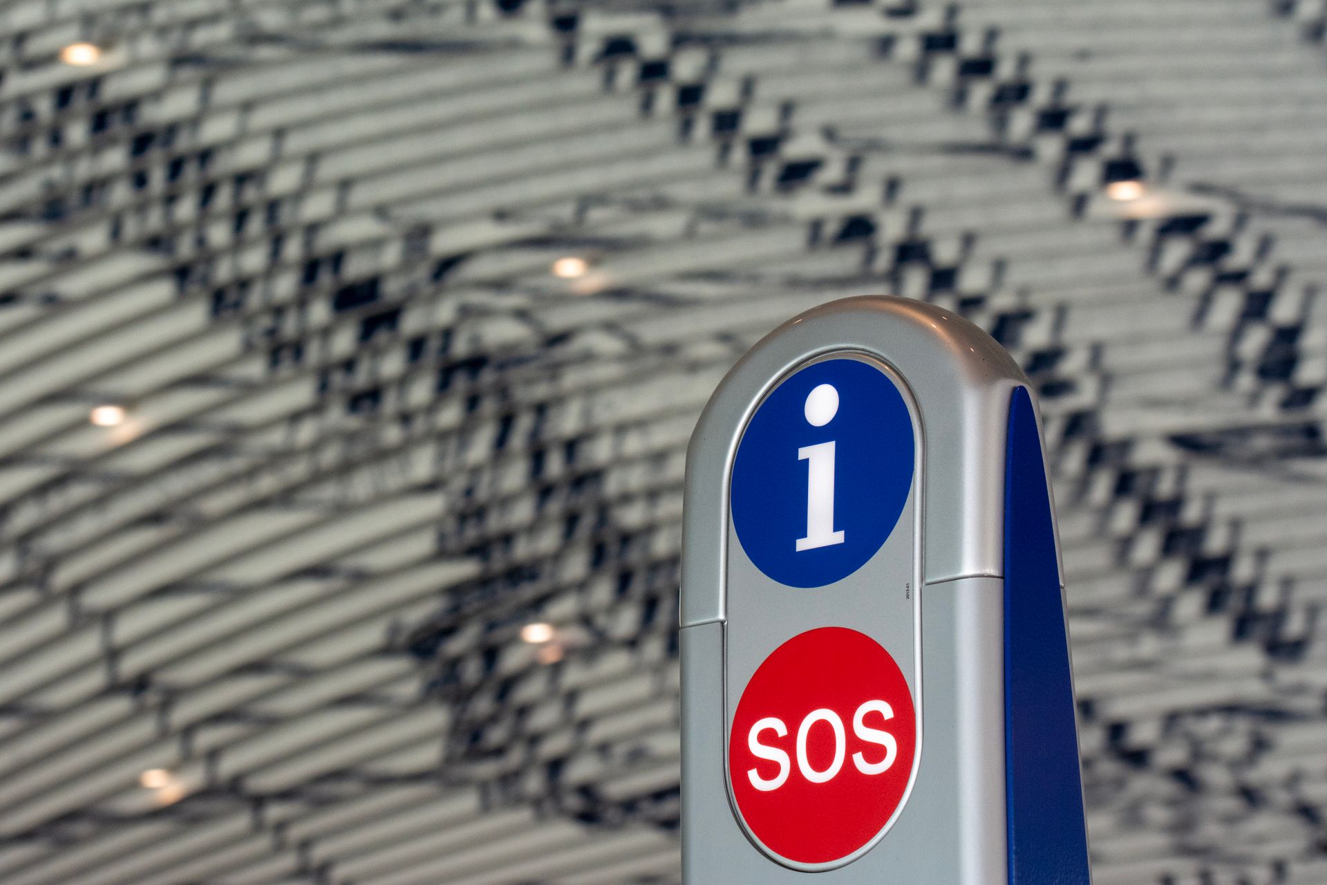 Close-up of a modern SOS information post at Delft Station, Netherlands.
