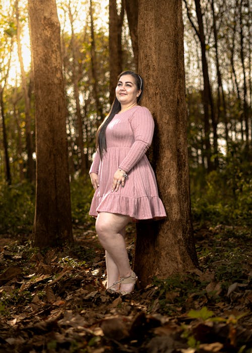 Woman in Pink Dress in Forest