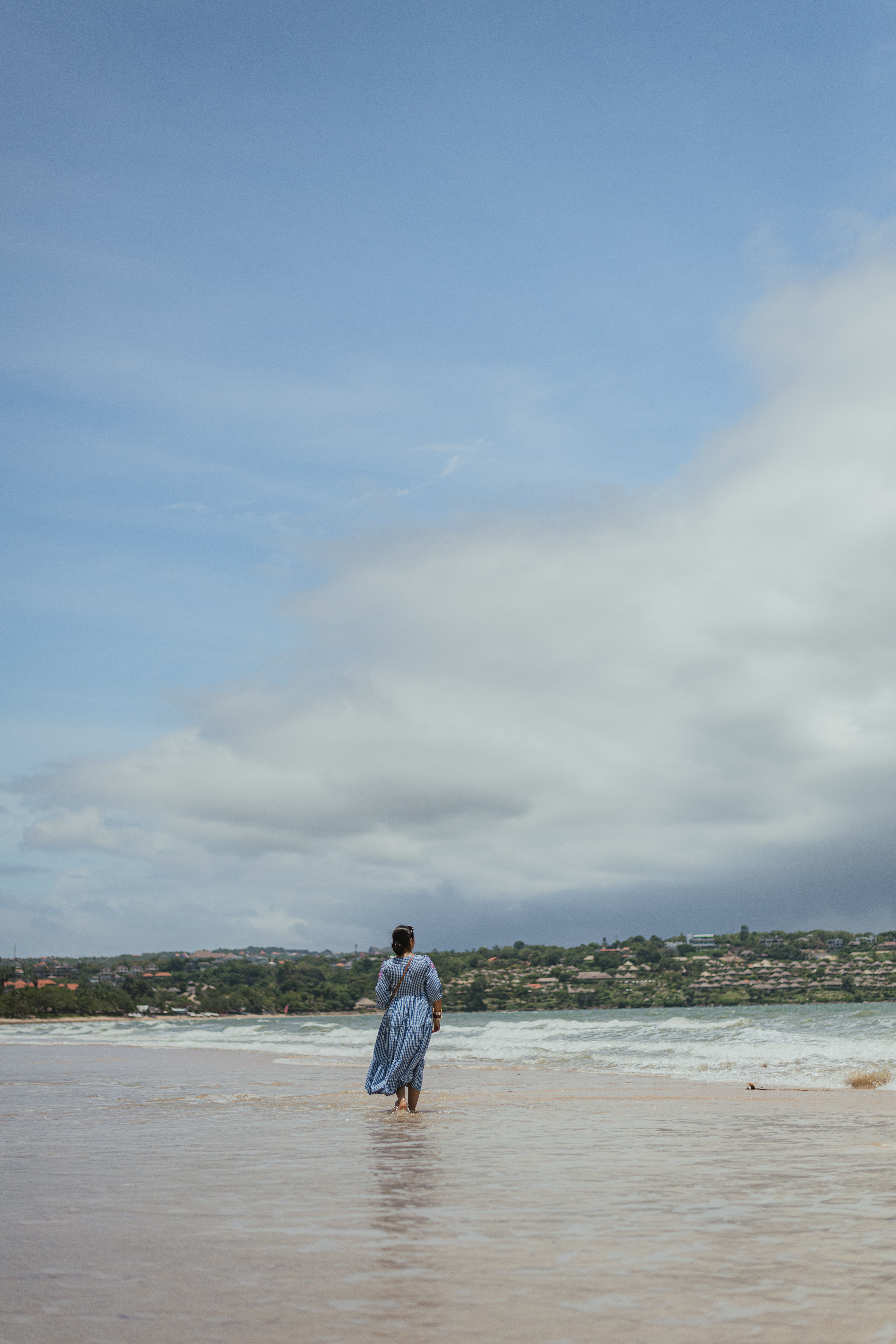 Woman in Blue Dress on Sea Shore · Free Stock Photo