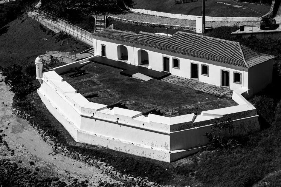 Black and white aerial photo of historic fort in Florianópolis, Brazil, showcasing architectural detail.