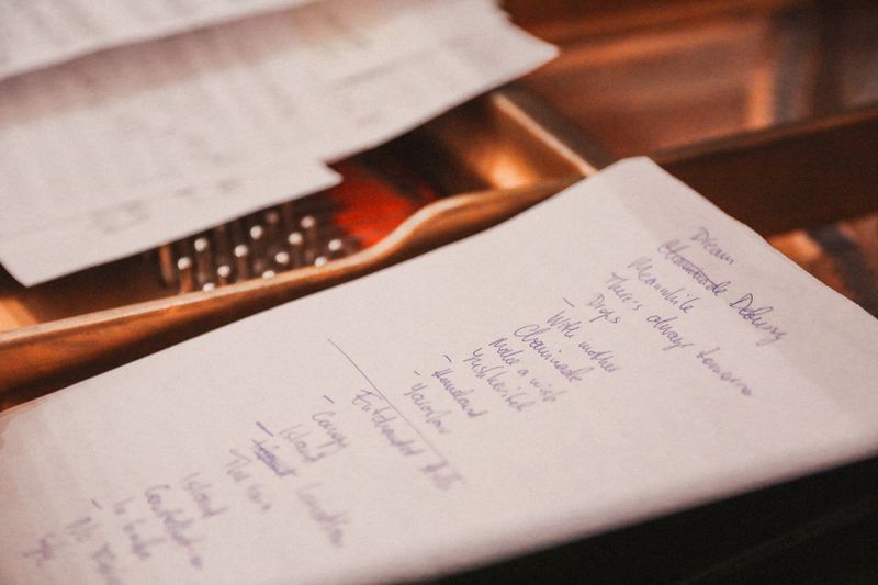 Close-up of a handwritten checklist on paper