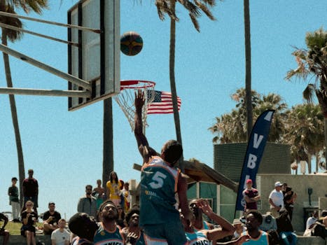 Dynamic basketball game at an outdoor court in Los Angeles, California.