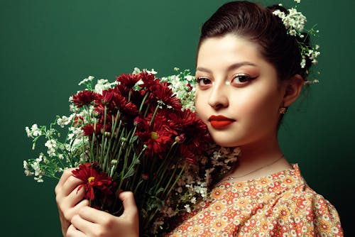 Model Wearing Makeup Posing with Flowers
