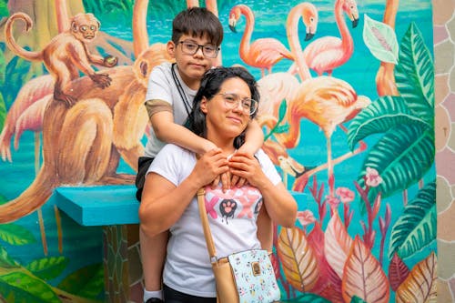 Mother with Son against Mural