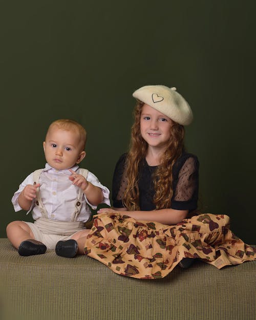 Studio Shot of a Girl and Her Baby Brother 