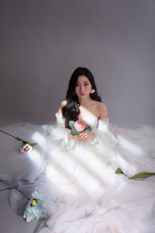 Beautiful Young Brunette in a White Tulle Dress