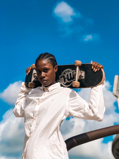 A Person Holding a Skateboard 