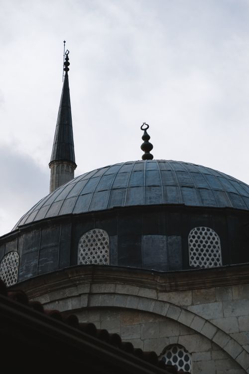 Free A detailed view of an Ottoman-style mosque's dome and minaret in Safranbolu, Türkiye. Stock Photo
