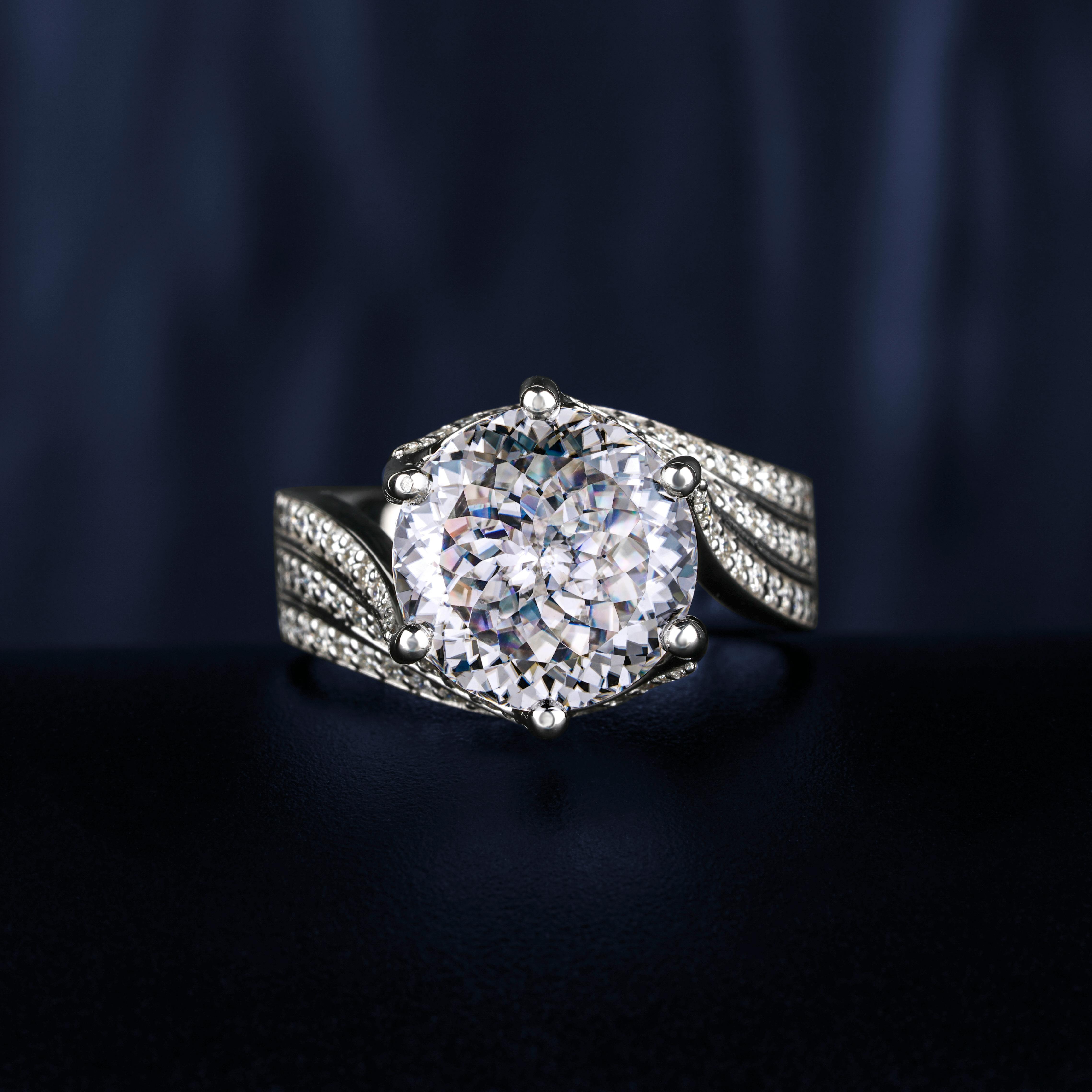 Silver diamond ring on black background