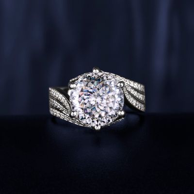 Silver diamond ring on black background