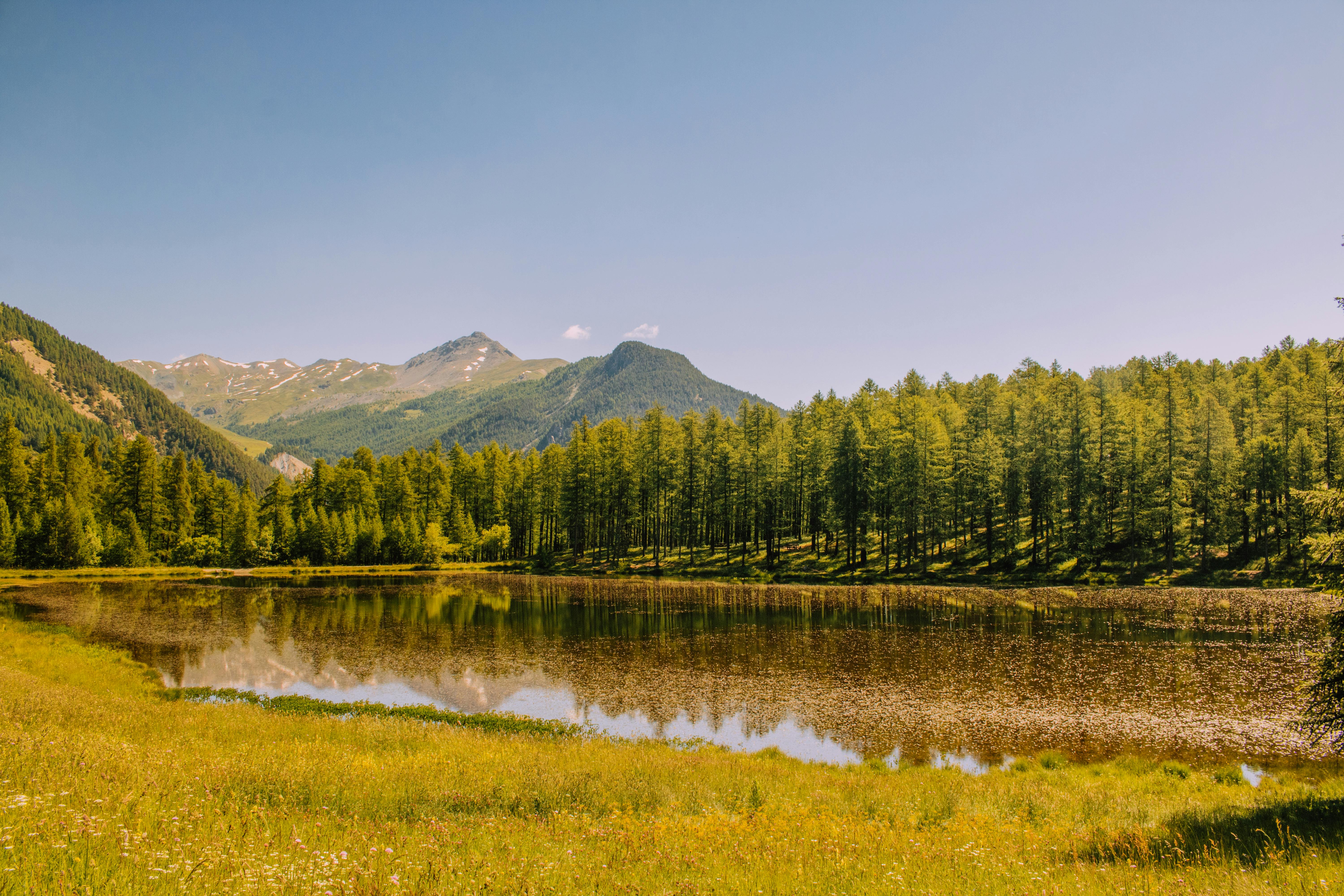 Peaceful mountains and lake scene in Ceillac, France, highlighting natural beauty.