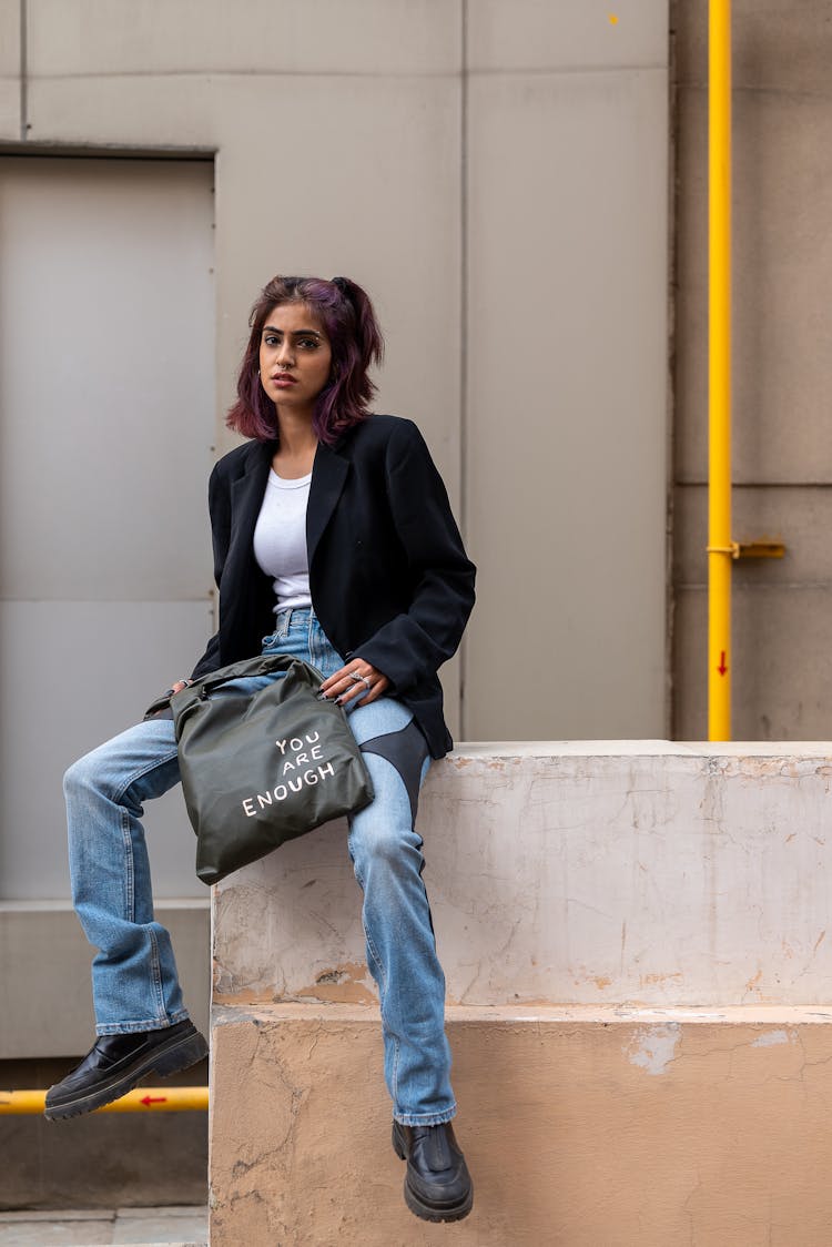 A Woman With A Tote Bag On A Street