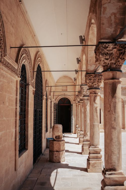 Free Explore the timeless beauty of Ottoman architecture in this corridor with ornate columns and arches. Stock Photo
