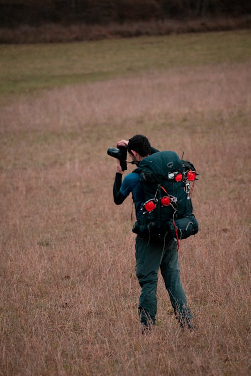 Man with Backpack and Camera