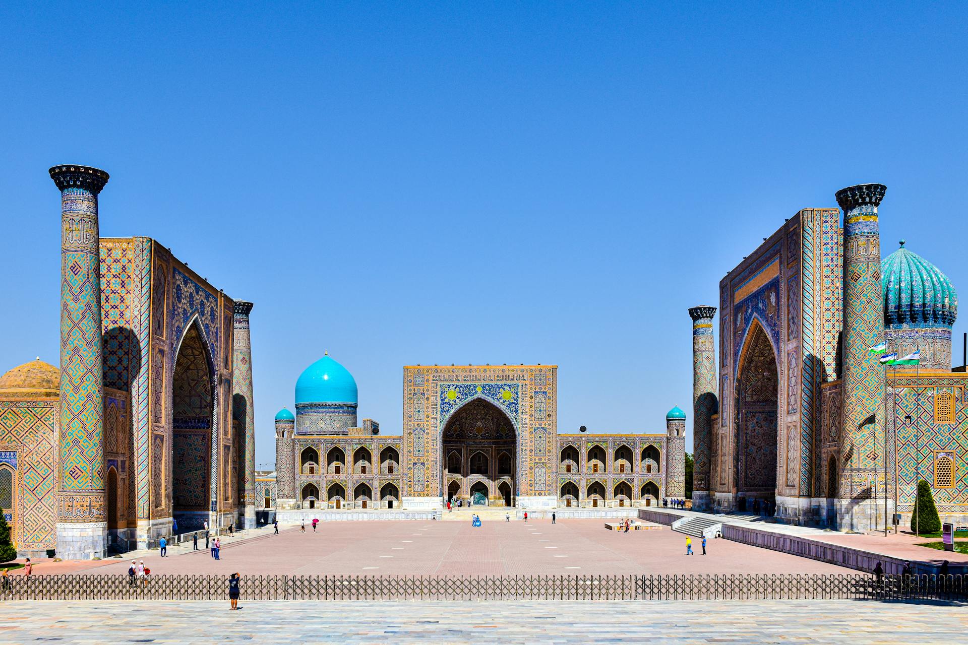 Explore the stunning architecture of Registan Square in Samarkand, Uzbekistan with vibrant mosaics and historical monuments.