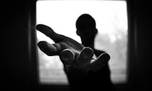 Man's Hand in Shallow Focus and Grayscale Photography