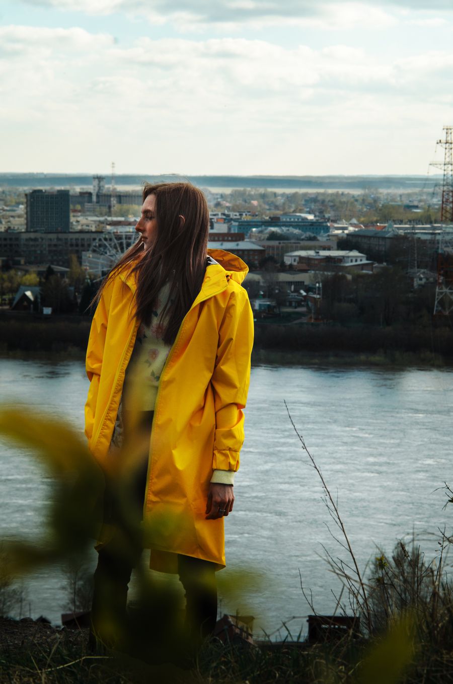 Model in a dark belted coat carrying a shell backpack — photo by Egor Litvinov on Pexels