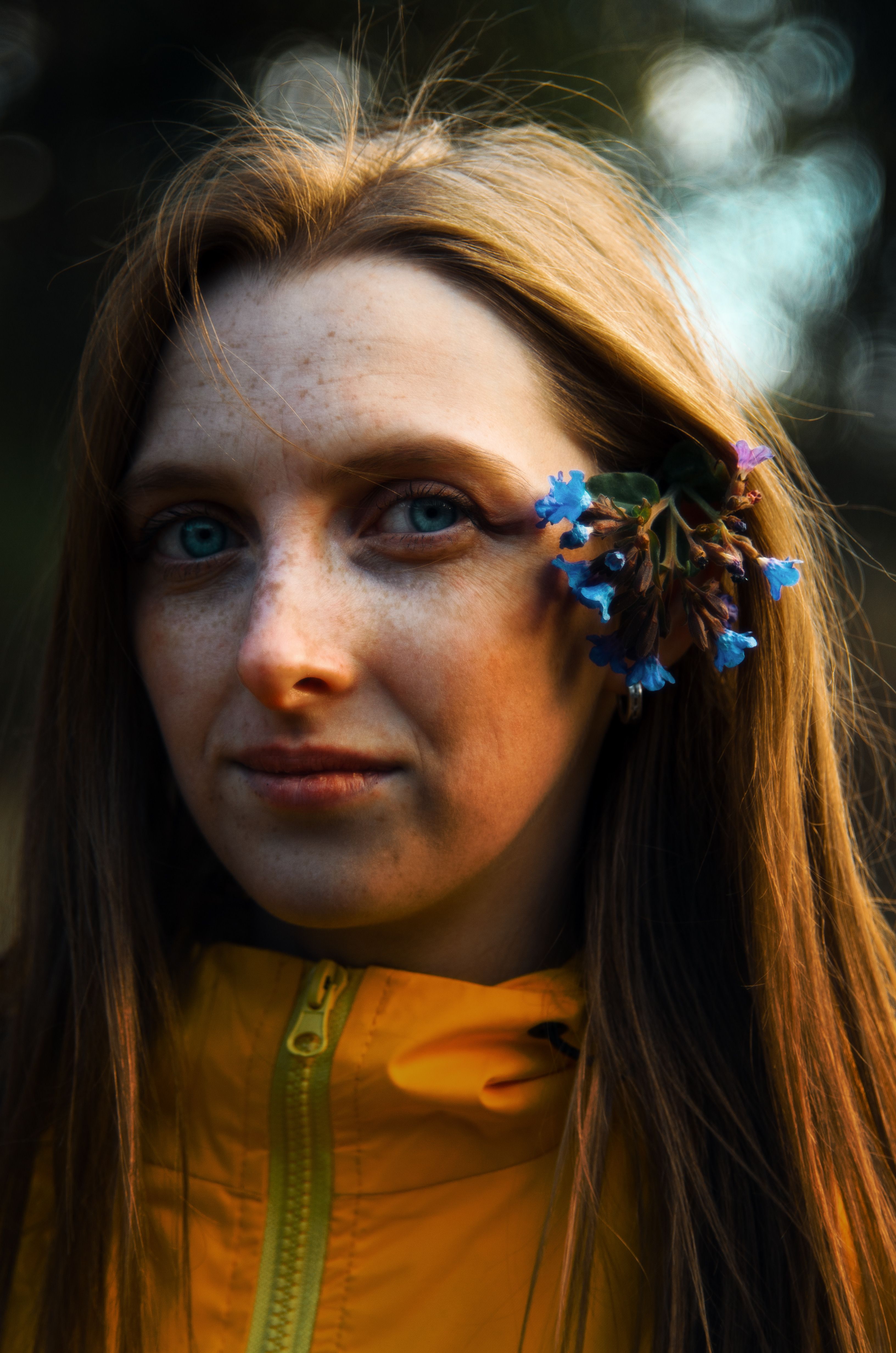 Young Woman with Flowers in Her Hair · Free Stock Photo