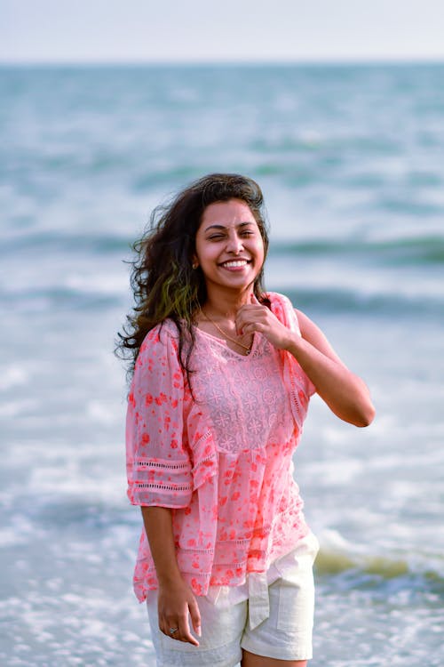 Smiling Woman on Sea Shore