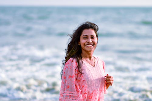 Smiling Brunette against Sea