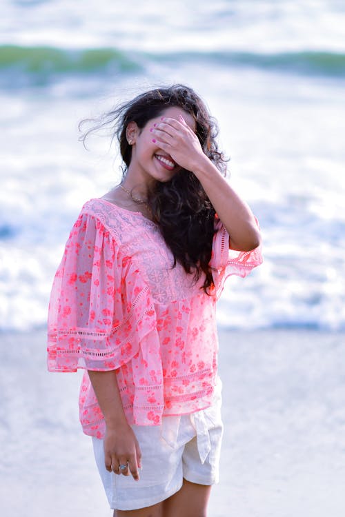 Smiling Woman Posing with Hand on Face