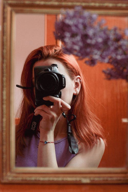 Mirror Reflection of Redhead with Camera 