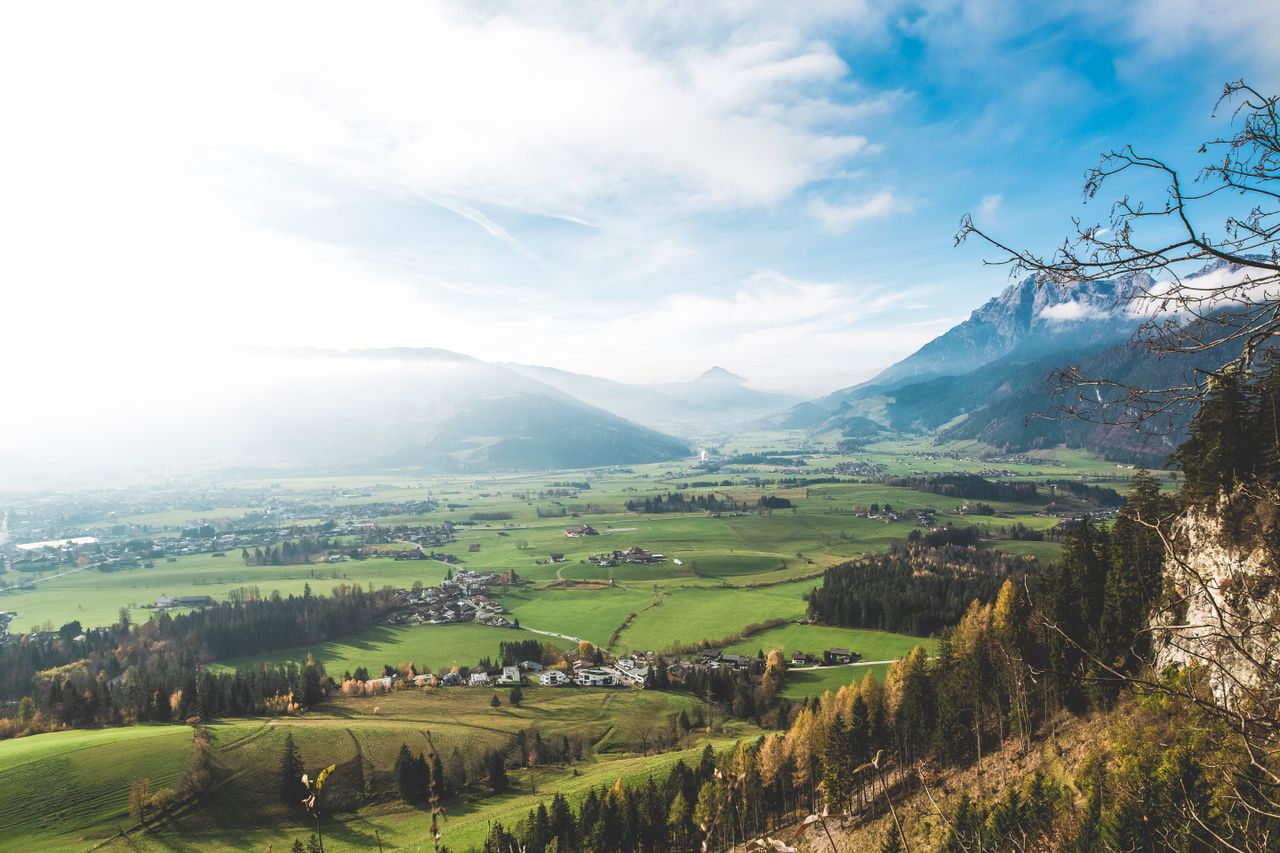 stunning view of a lush valley with mountains perfect for nature lover