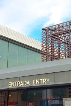 Contemporary building entrance in Barcelona with modern glass facade and architectural design.