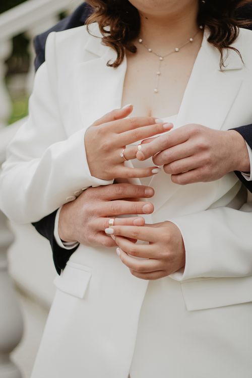 Free Close-up of a couple embracing, displaying rings and affection. Stock Photo