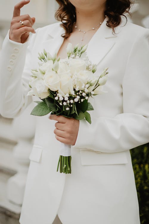 Bride Holding White Roses