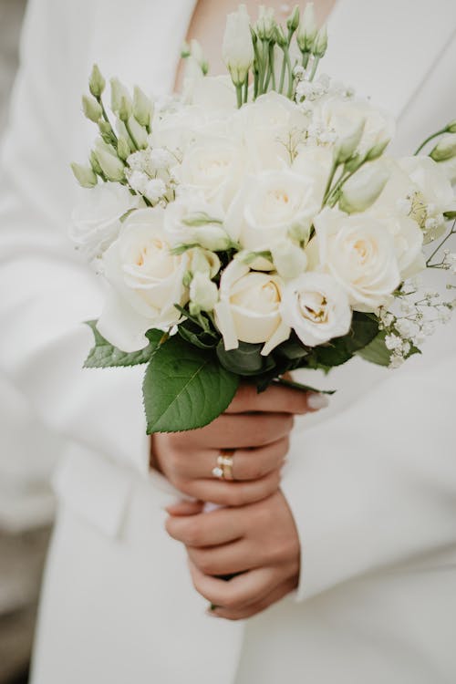 Bunch of Wedding Roses in Bride Hands